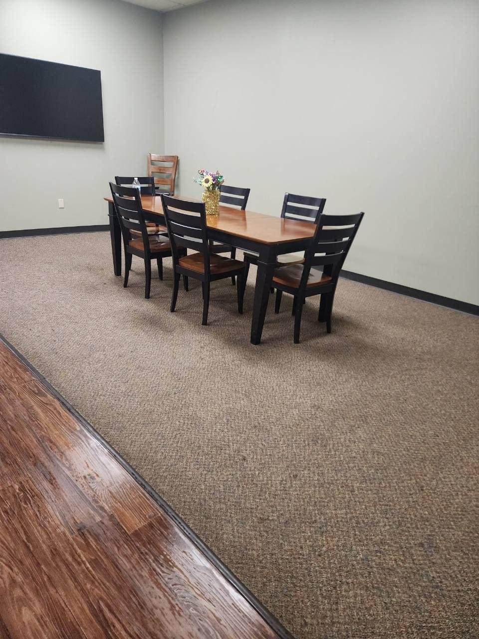 Break room after cleaning, carpet vacuumed and table cleared