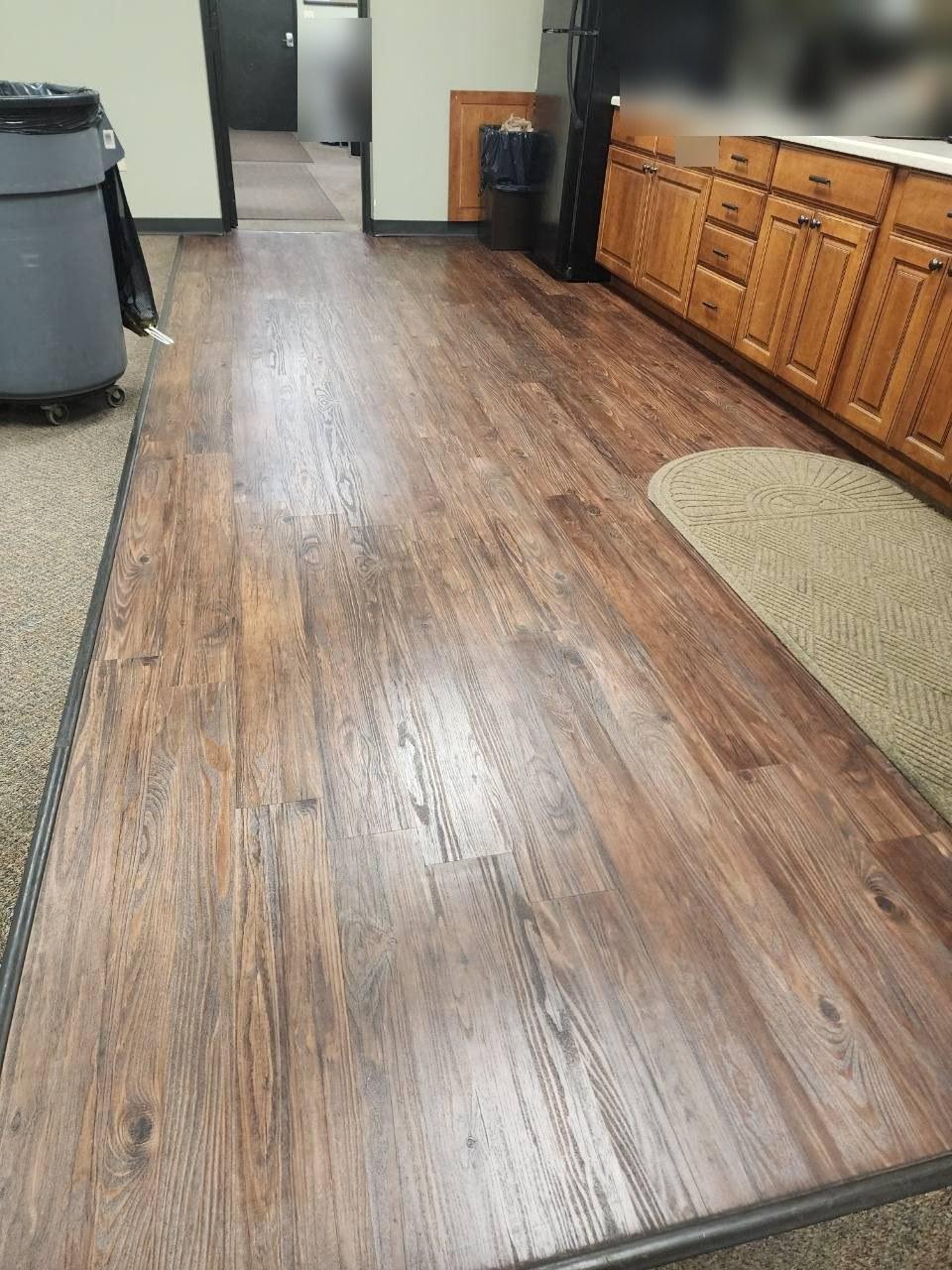 Distribution center break room floor before mopping