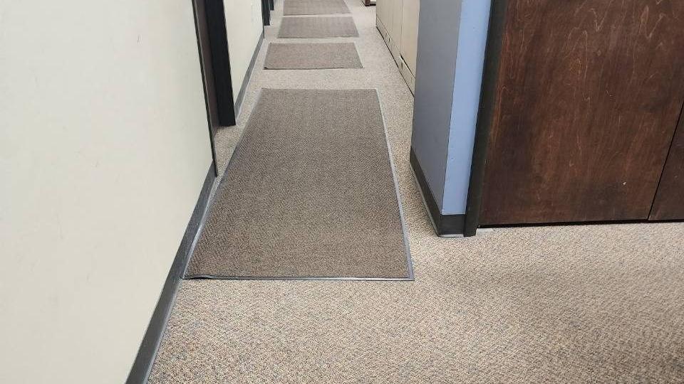 Office hallway with entry mats after cleaning