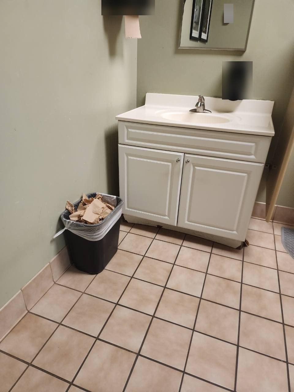 Restroom vanity before cleaning