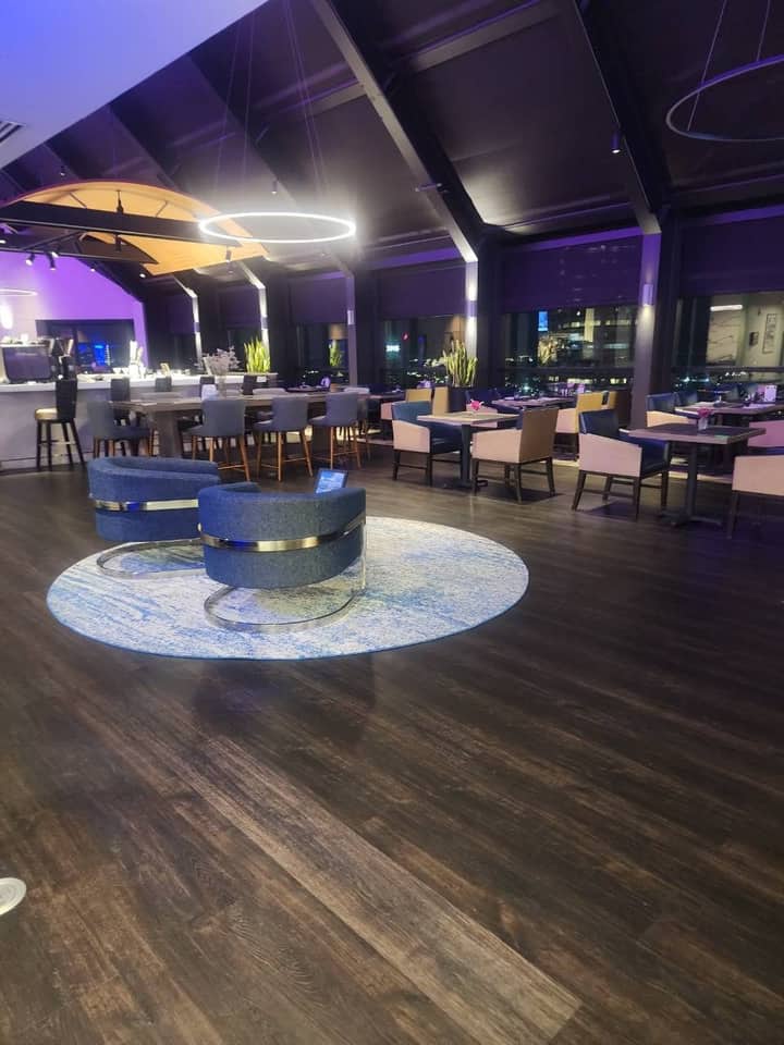Lounge and dining room of a private downtown Indianapolis club after evening cleaning service by Chow Connections